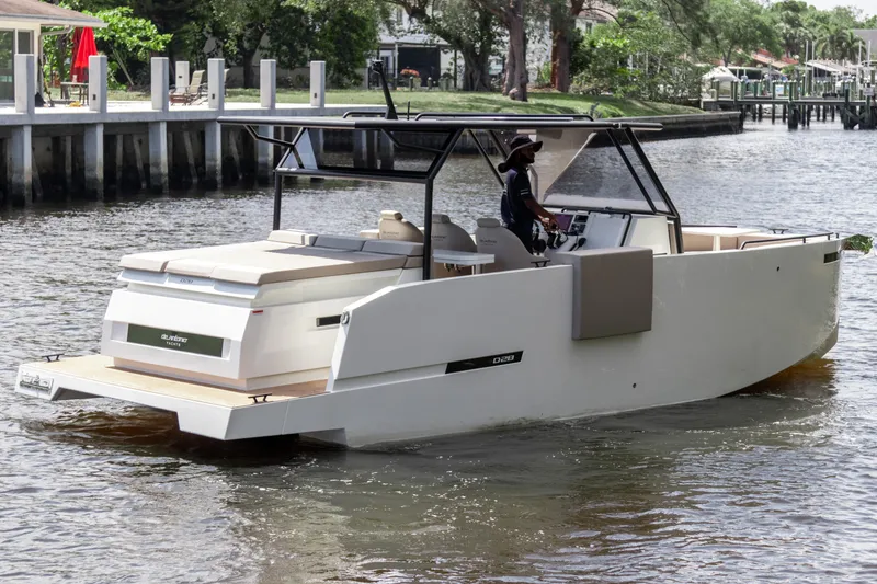Slide: The Image of 2024 De Antonio Yachts D28 Xplorer cruising on a calm river. - 3