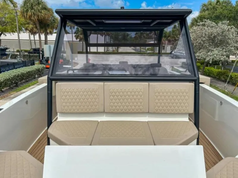 Slide: The Image of 2024 De Antonio Yachts D28 Xplorer with beige diamond-stitched seating and modern design. - 8