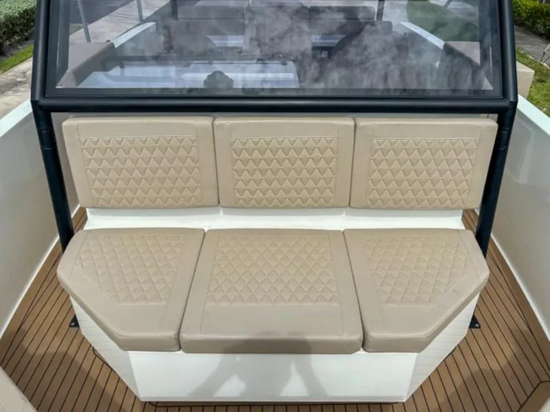 Slide: The Image of 2024 De Antonio Yachts D28 Xplorer, beige cushioned seating, teak deck. - 9