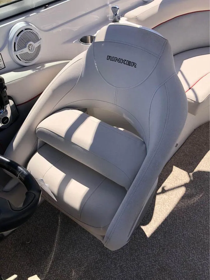 Slide: The Image of 2013 Rinker 246 Captiva Bowrider seat, featuring sleek design and comfortable upholstery. - 3