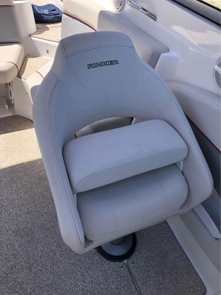 Slide: The Image of 2013 Rinker 246 Captiva Bowrider seat, gray upholstery, interior view. - 4