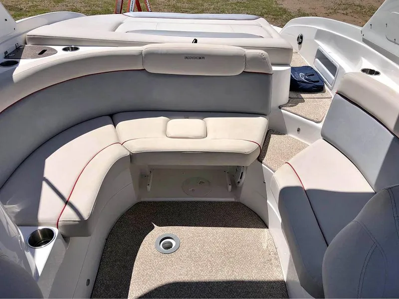 Slide: The Image of 2013 Rinker 246 Captiva Bowrider interior with plush seating and cup holders. - 6
