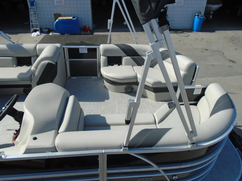 Slide: The Image of 2023 Trifecta 24TRFC LE 2.75 pontoon boat interior with beige seating. - 8