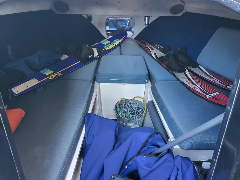 Slide: The Image of Interior of 1988 Wellcraft 220 Elite boat with water skis and gear. - 5