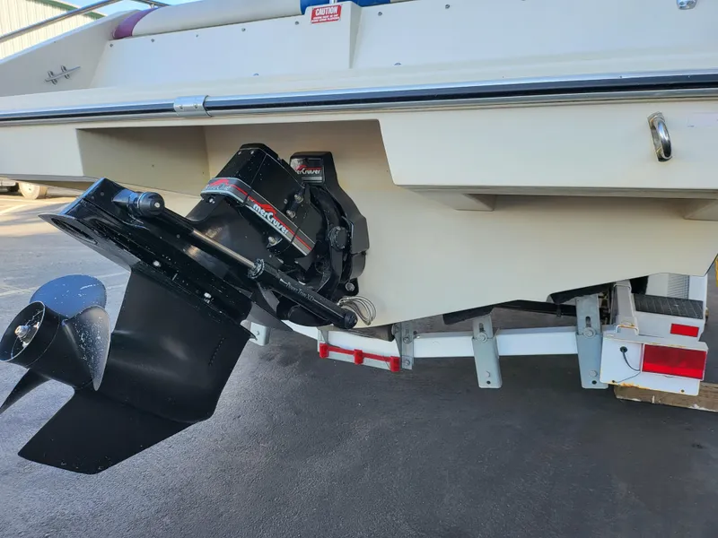 Slide: The Image of 1988 Wellcraft 220 Elite boat stern with outboard motor and propeller. - 8