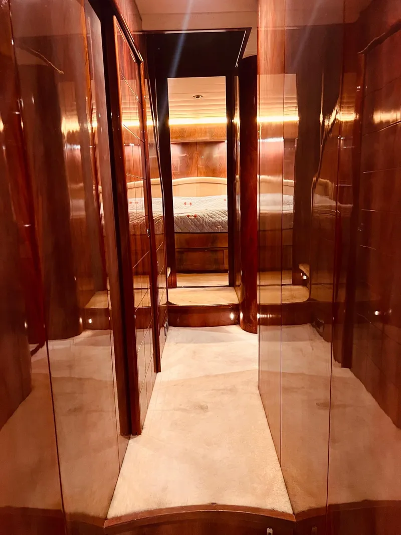 Slide: The Image of Luxurious wooden interior of a 2001 Maiora 20 yacht cabin. - 23