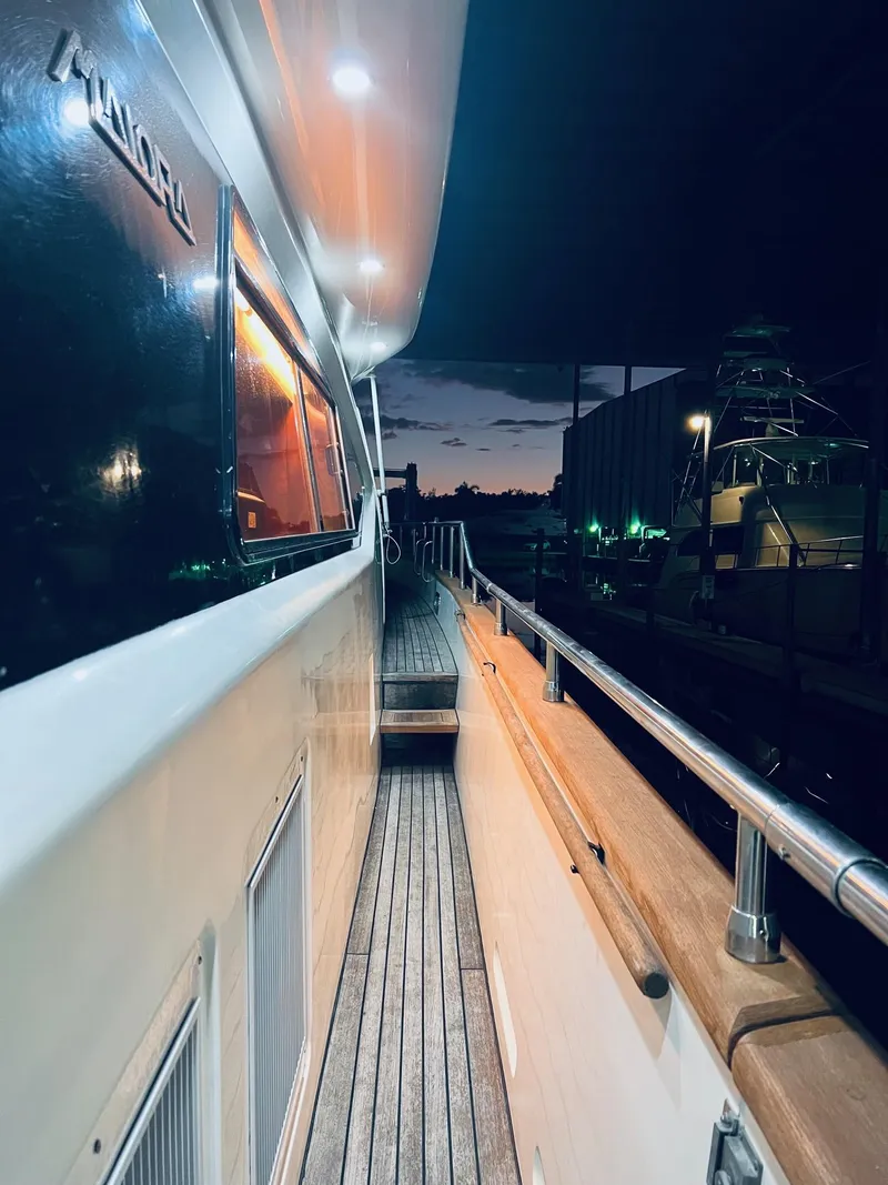 Slide: The Image of Side deck of a 2001 Maiora 20 yacht at night. - 3