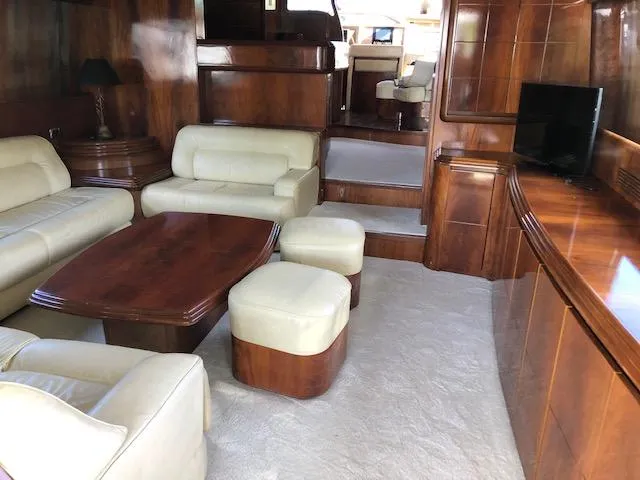 Slide: The Image of Luxurious interior of 2001 Maiora 20 yacht with leather seating and wooden finishes. - 8