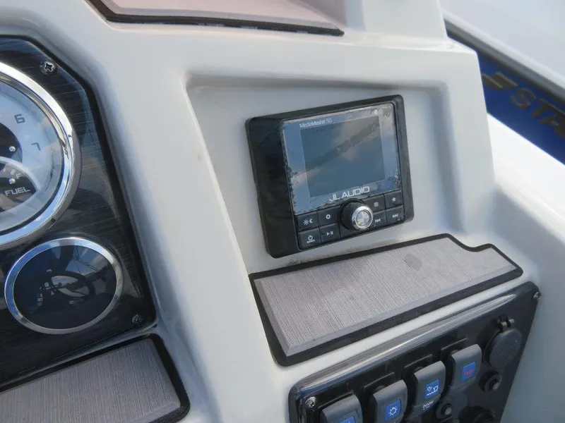 Slide: The Image of Close-up of 2022 Starcraft 231 OB boat dashboard with JL Audio system. - 10