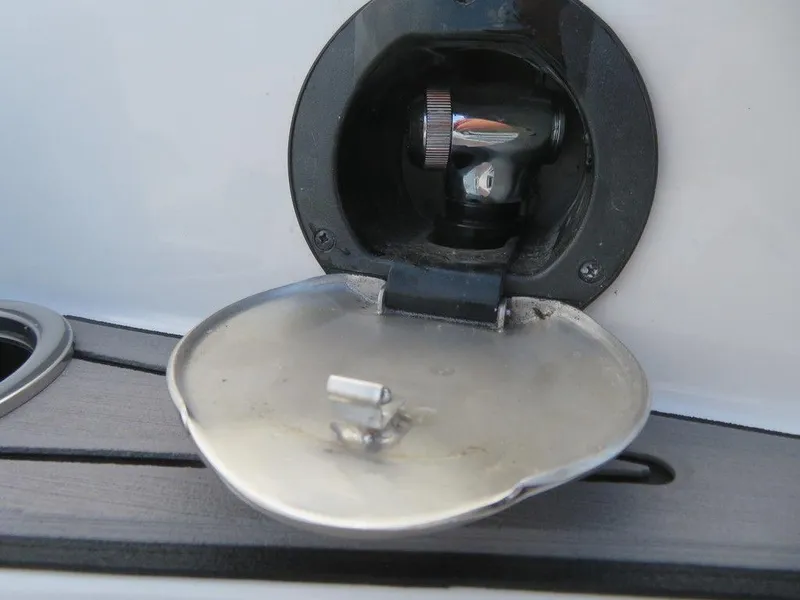 Slide: The Image of Fuel cap of a 2022 Starcraft 231 OB boat. - 12