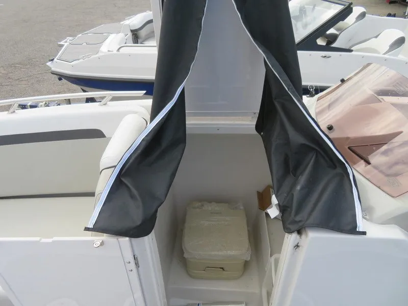 Slide: The Image of 2022 Starcraft 231 OB boat interior with enclosed portable toilet. - 15