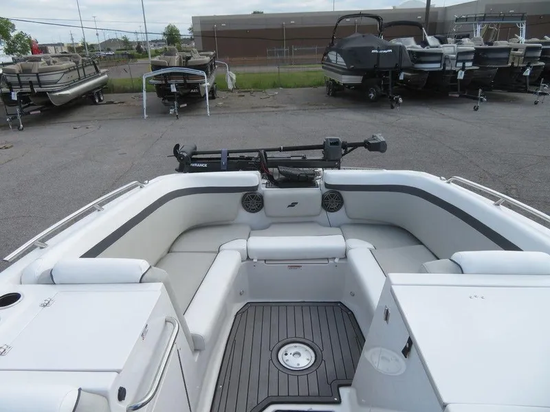 Slide: The Image of 2022 Starcraft 231 OB boat interior with seating and storage compartments. - 19