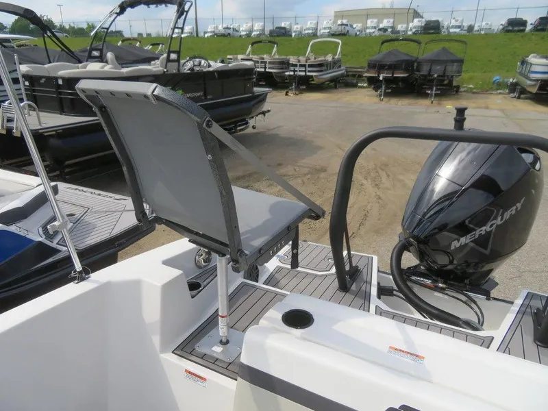 Slide: The Image of 2022 Starcraft 231 OB boat with Mercury outboard motor at a marina. - 26