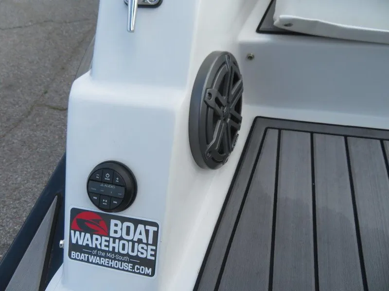 Slide: The Image of 2022 Starcraft 231 OB boat deck with speaker and Boat Warehouse sticker. - 4