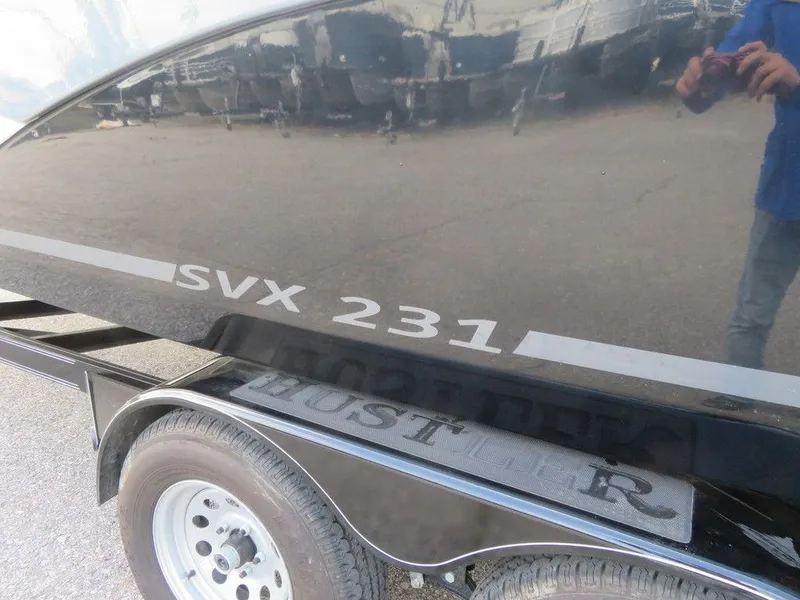 Slide: The Image of 2022 Starcraft SVX 231 OB boat on trailer, side view. - 5