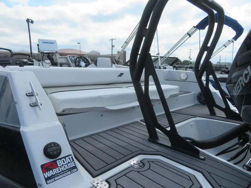 Slide: The Image of 2022 Starcraft 231 OB boat interior with seating and deck view. - 6