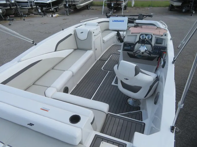 Slide: The Image of 2022 Starcraft 231 OB boat interior with seating and navigation equipment. - 8