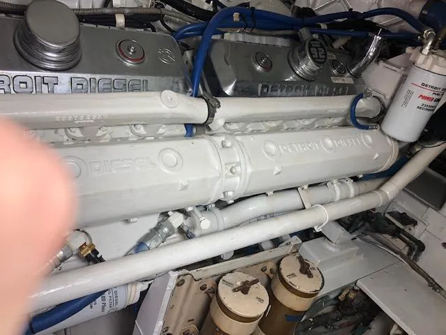 Slide: The Image of 1997 Bertram Convertible engine compartment with Detroit Diesel engines. - 21