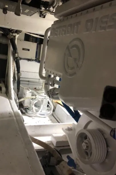 Slide: The Image of Engine room of a 1997 Bertram Convertible boat with Detroit Diesel engine. - 26