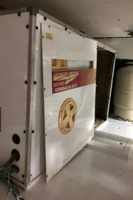 Slide: The Image of Northern Lights generator set in a 1997 Bertram Convertible boat. - 27