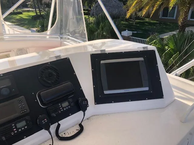 Slide: The Image of Control panel of a 1997 Bertram Convertible yacht with navigation equipment. - 30