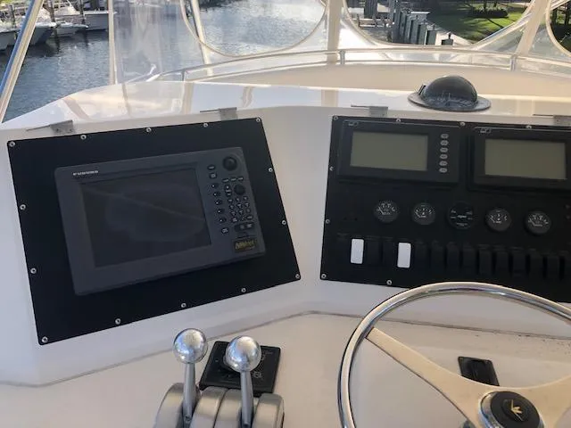 Slide: The Image of 1997 Bertram Convertible boat helm with navigation and control systems. - 32