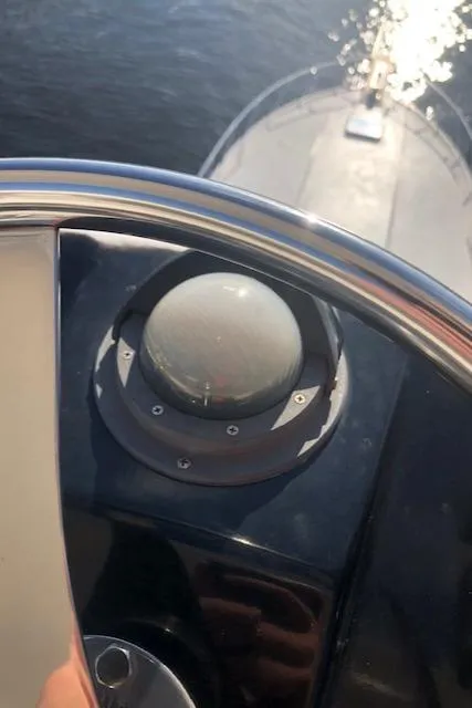 Slide: The Image of Close-up of the helm on a 1997 Bertram Convertible boat. - 38
