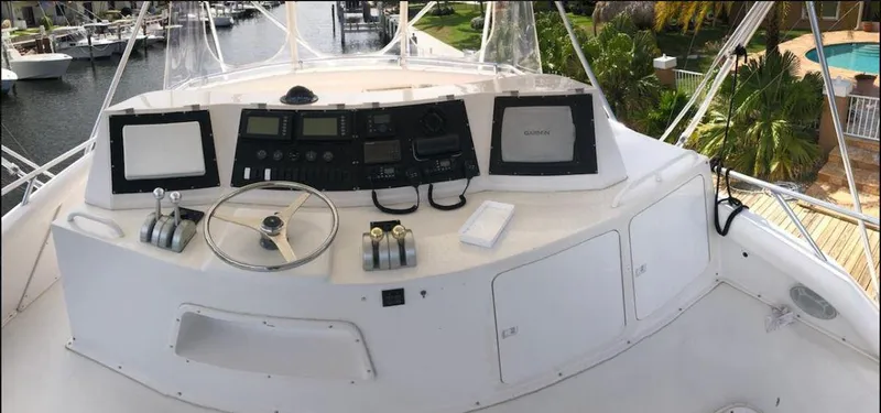 Slide: The Image of 1997 Bertram Convertible yacht helm with navigation equipment and controls. - 4