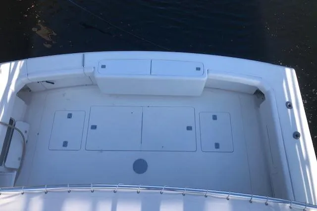Slide: The Image of 1997 Bertram Convertible boat deck with storage compartments. - 47