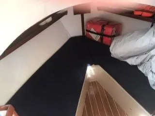 Slide: The Image of Interior cabin of a 1992 Crosby Tug boat with sleeping area and storage. - 13