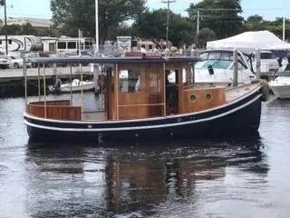 Slide: The Image of 1992 Crosby Tug boat docked in a marina. - 5
