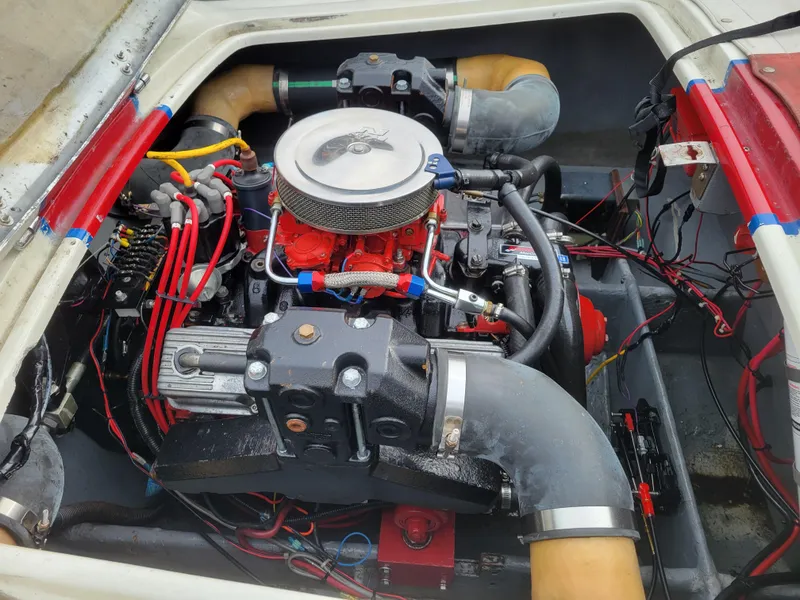 Slide: The Image of Engine of a 1973 Donzi X18 boat, showcasing detailed components and wiring. - 10