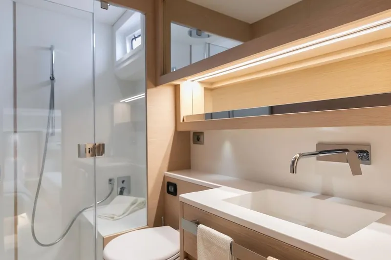 Slide: The Image of Luxurious bathroom in 2027 Solaris Power 52 Open yacht, featuring modern fixtures and elegant design. - 10