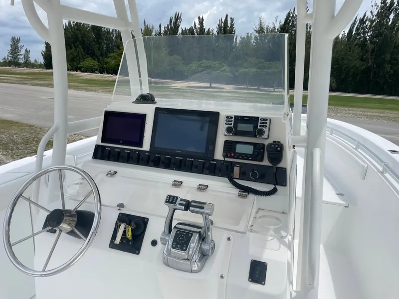 Slide: The Image of 2006 Angler 2900CC boat console with steering wheel and navigation equipment. - 16