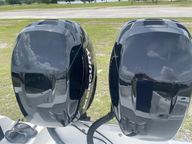 Slide: The Image of Twin Mercury outboard engines on a 2006 Angler 2900CC boat. - 24