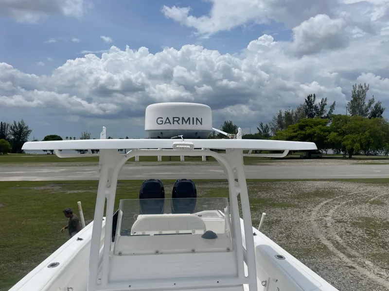 Slide: The Image of 2006 Angler 2900CC boat with Garmin radar under cloudy sky. - 28