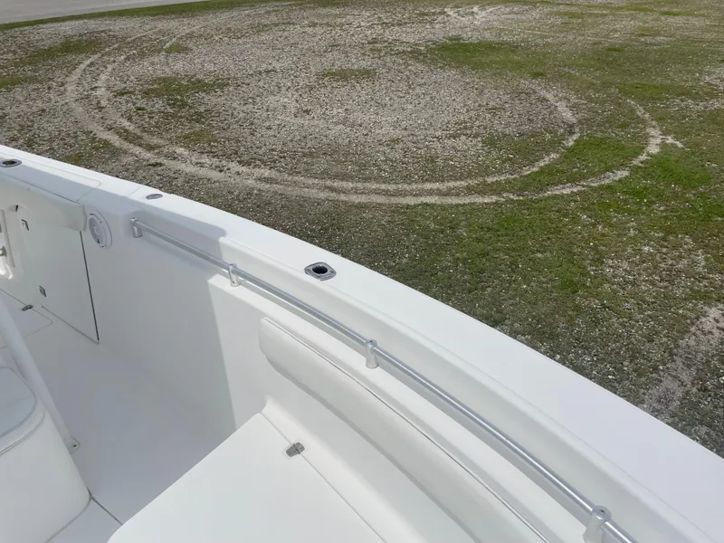 Slide: The Image of 2006 Angler 2900CC boat deck with railing and seating. - 31