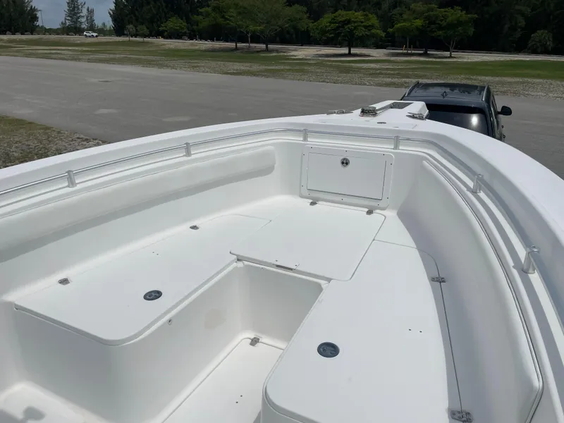 Slide: The Image of 2006 Angler 2900CC boat bow area with seating and storage compartments. - 32