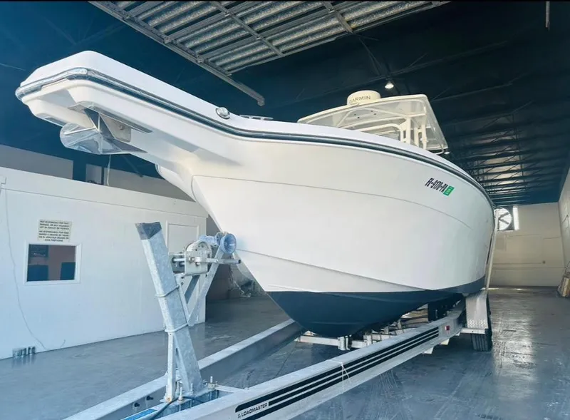 Slide: The Image of 2006 Angler 2900CC boat on trailer in indoor storage facility. - 35