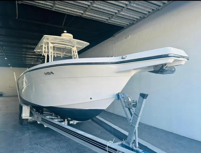 Slide: The Image of 2006 Angler 2900CC boat on trailer in storage facility. - 36