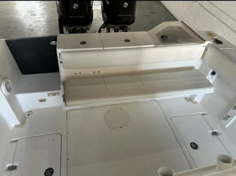 Slide: The Image of 2006 Angler 2900CC boat interior with twin outboard motors. - 40