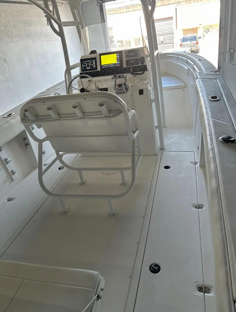 Slide: The Image of 2006 Angler 2900CC center console boat interior with helm station and seating. - 41