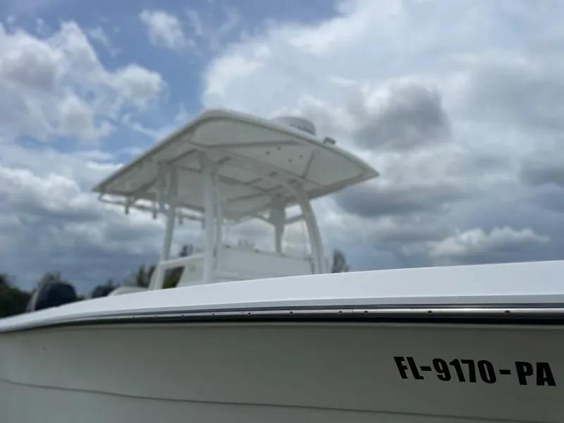 Slide: The Image of 2006 Angler 2900CC boat under cloudy sky with registration number FL-9170-PA. - 6