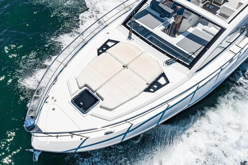 Slide: The Image of 2017 Cruisers Yachts 390 Express Coupe cruising on water, aerial view. - 13