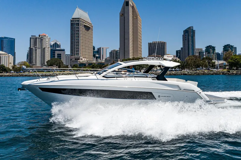 Slide: The Image of 2017 Cruisers Yachts 390 Express Coupe cruising in urban waterfront. - 2