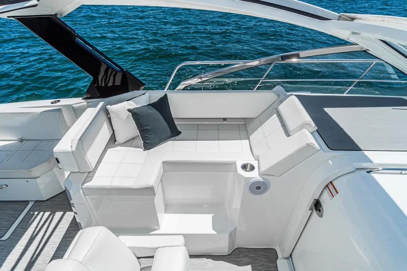 Slide: The Image of 2017 Cruisers Yachts 390 Express Coupe interior seating area with ocean view. - 22