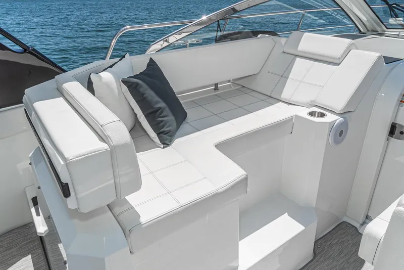 Slide: The Image of 2017 Cruisers Yachts 390 Express Coupe, white leather seating area on deck. - 23