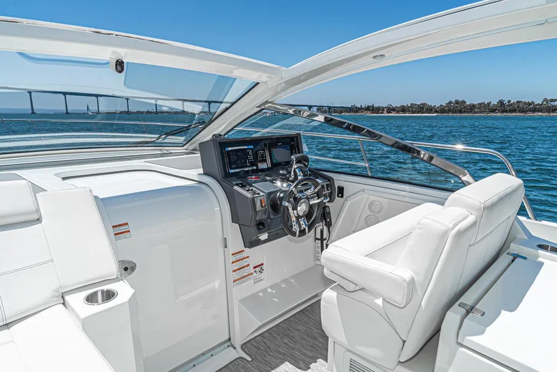 Slide: The Image of 2017 Cruisers Yachts 390 Express Coupe helm with ocean view. - 26