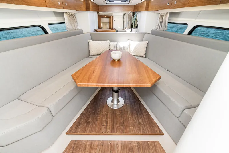 Slide: The Image of Interior of 2017 Cruisers Yachts 390 Express Coupe with elegant dining area. - 28