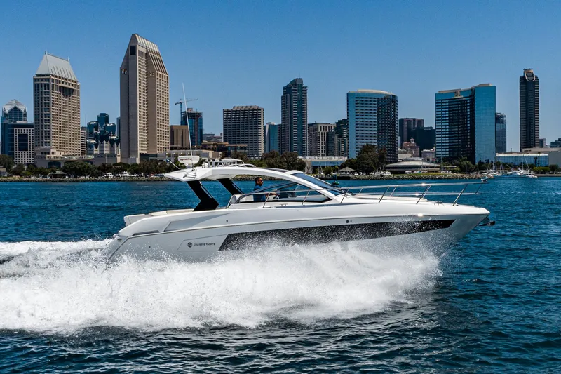 Slide: The Image of 2017 Cruisers Yachts 390 Express Coupe cruising near city skyline. - 3
